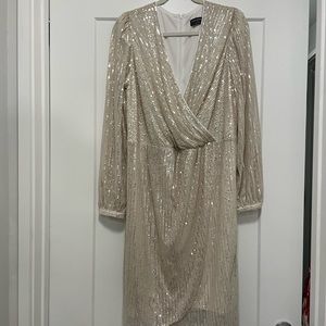 Never worn, beautiful and comfortable cream sequined faux wrap dress.